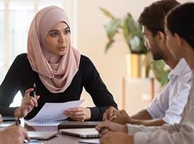 three employees having a meeting