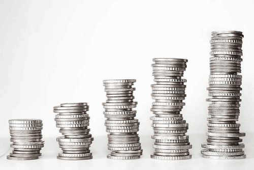 A stack of coins representing an employees time at a company.