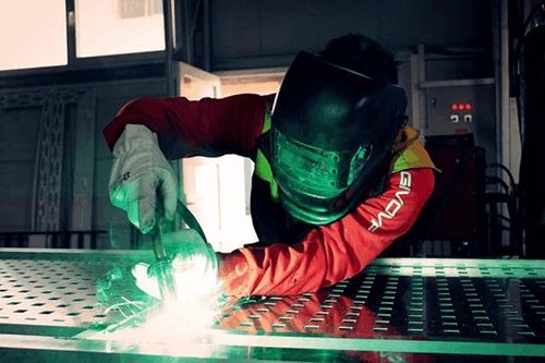 Man using a grinder.