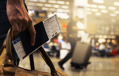 An image of a passport and boarding pass.