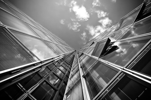 tall glass building with open windows