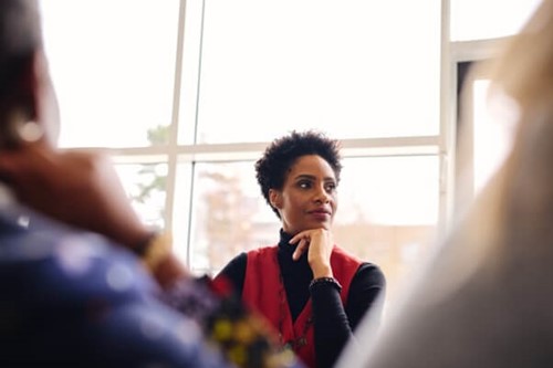 An employer sitting in a meeting