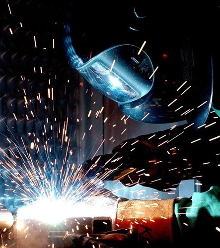 Employee wearing a welding mask